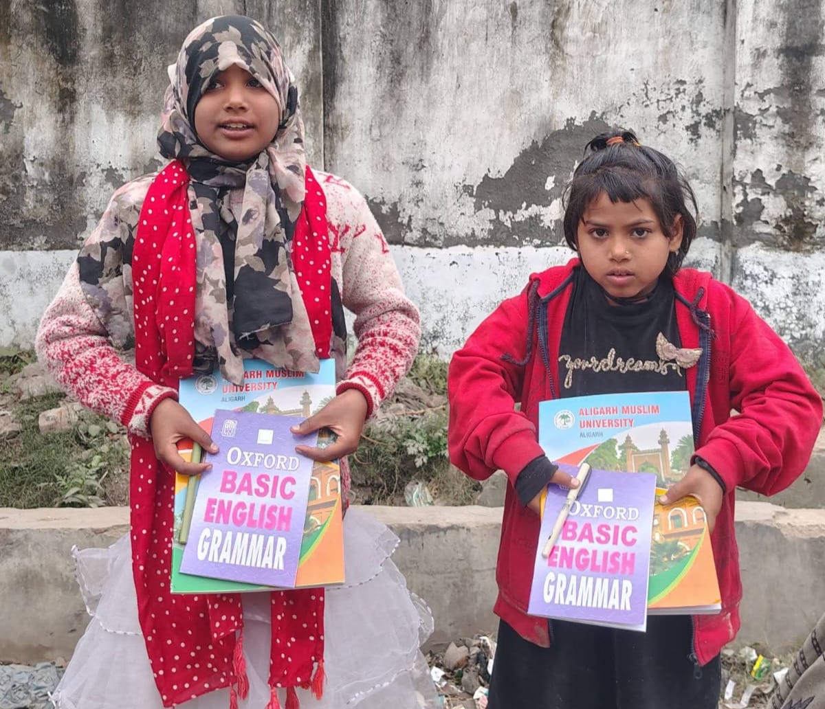 Two girls with grammar books