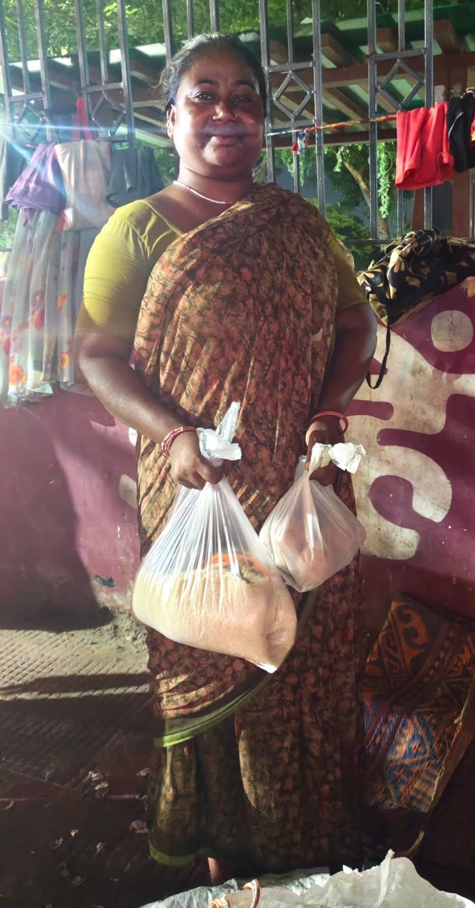 Woman with food ration bags
