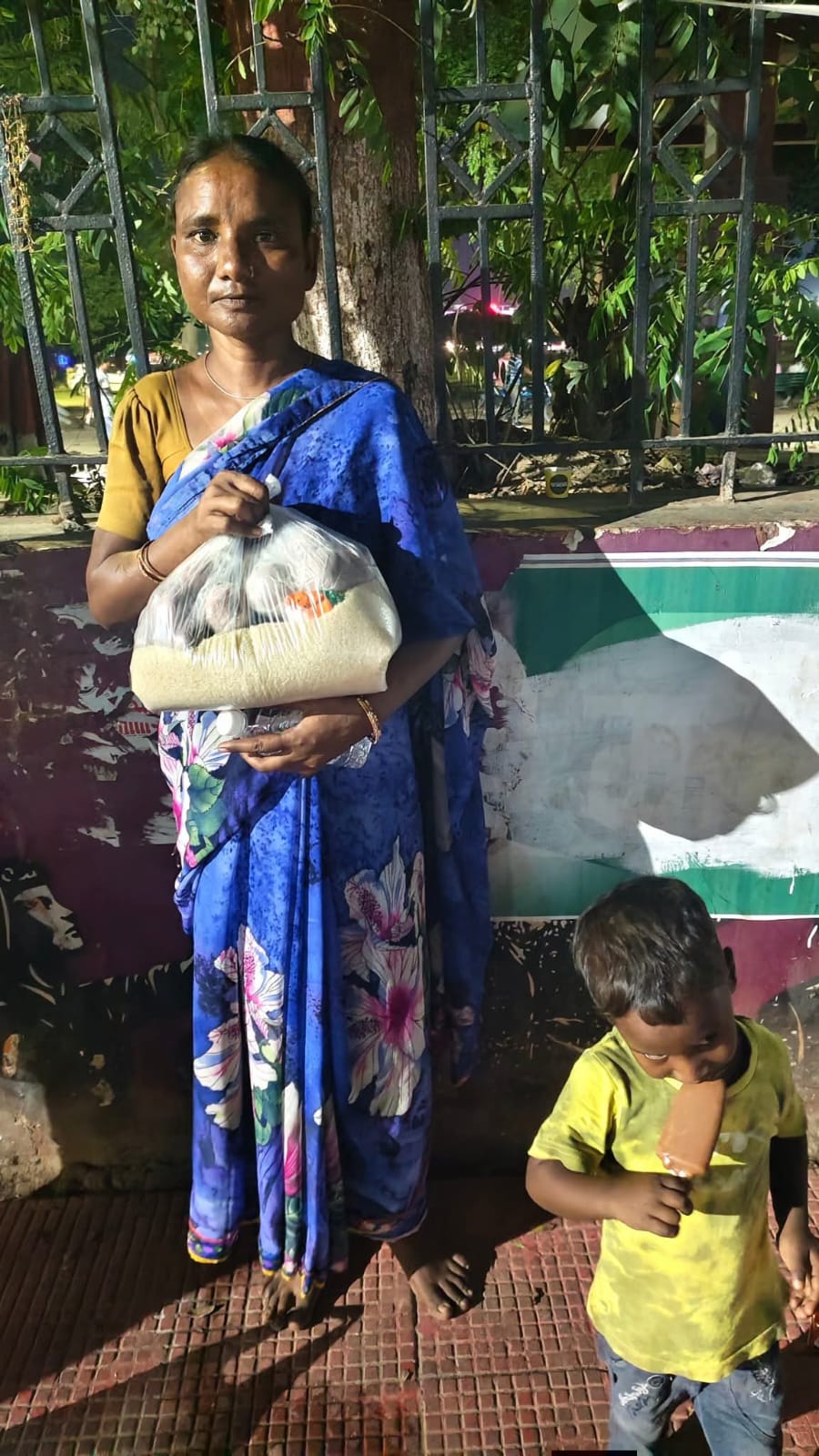 Mother with child receiving supplies