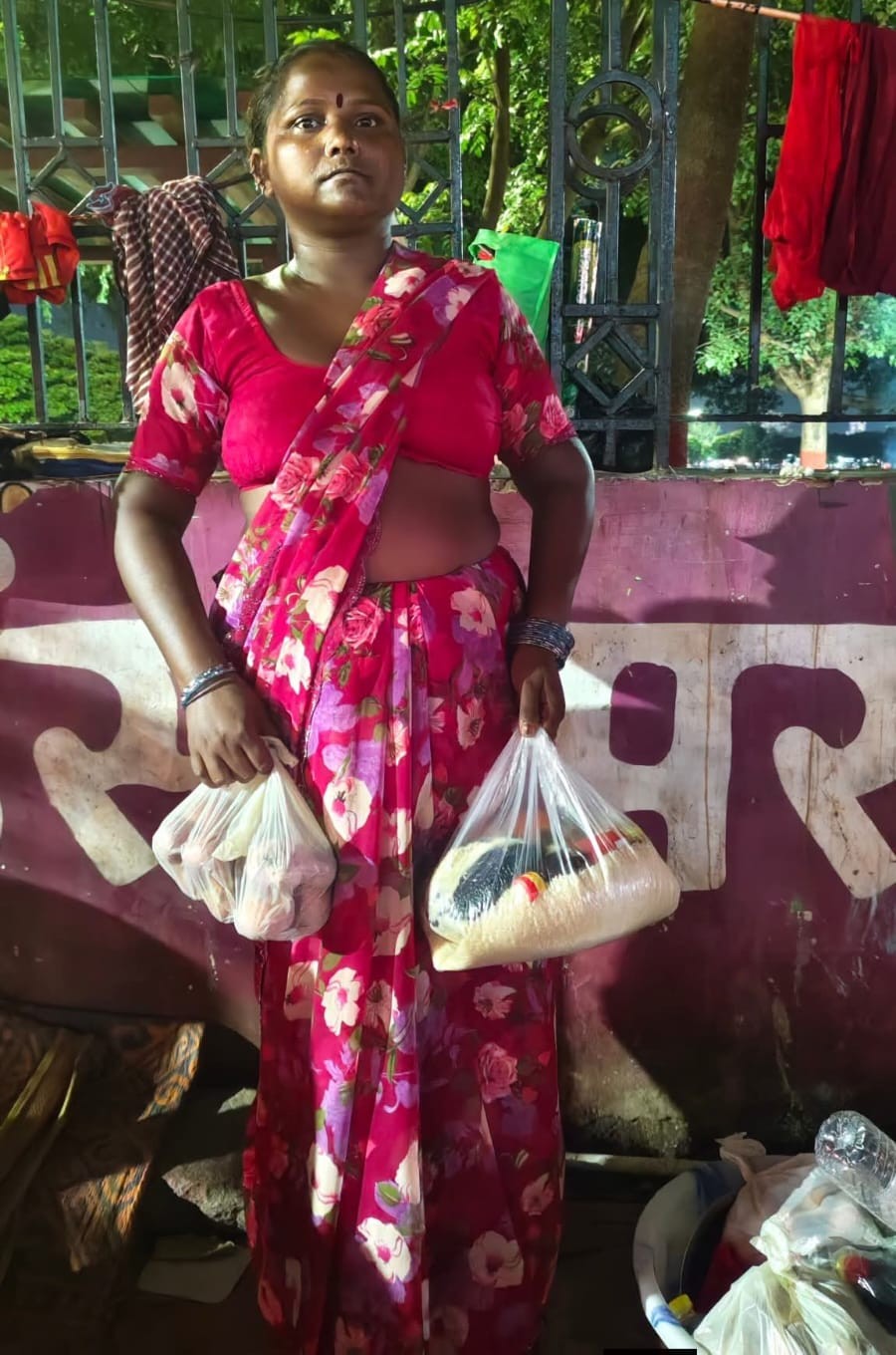 Woman receiving food essentials