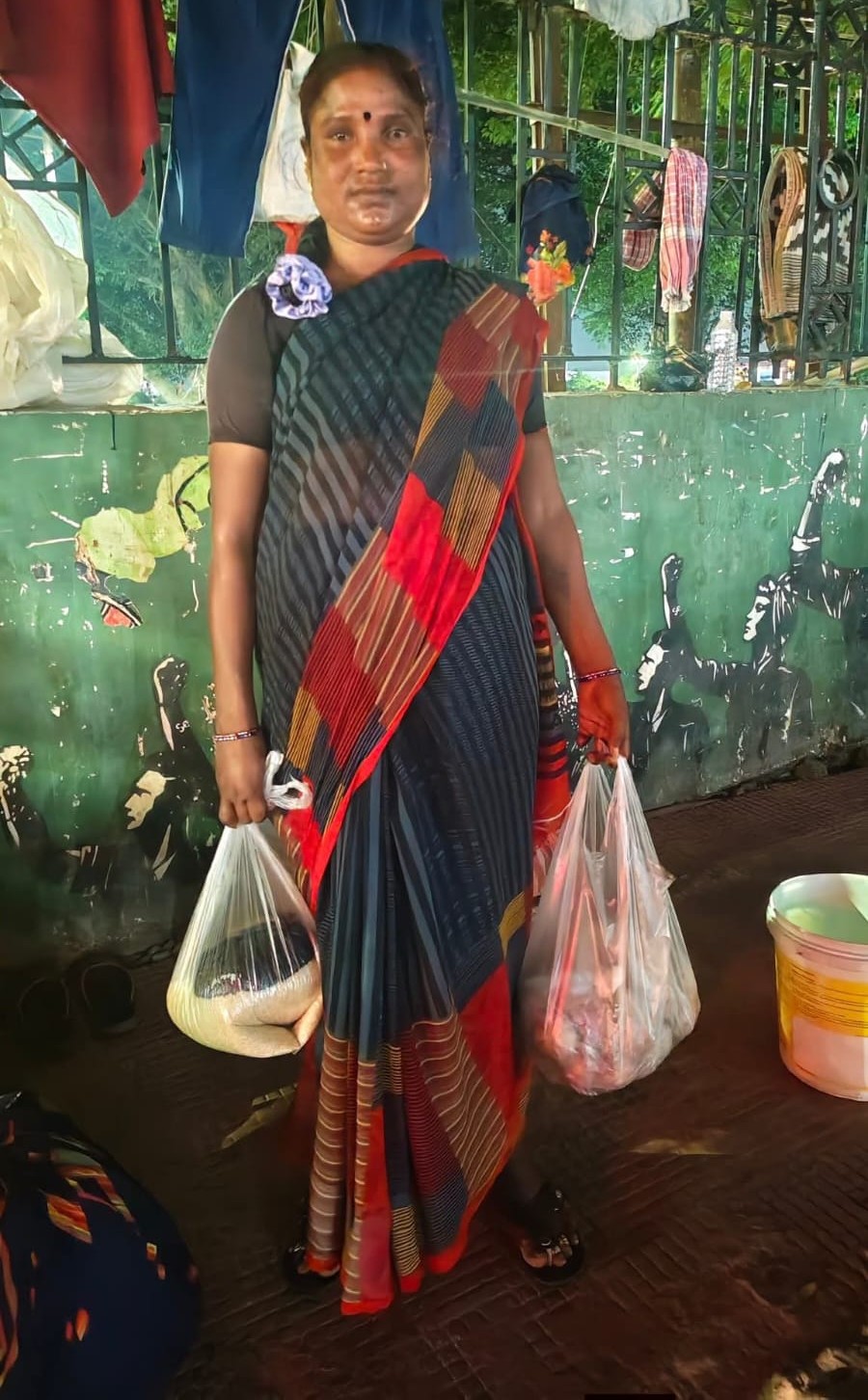 Woman with ration bags at distribution point